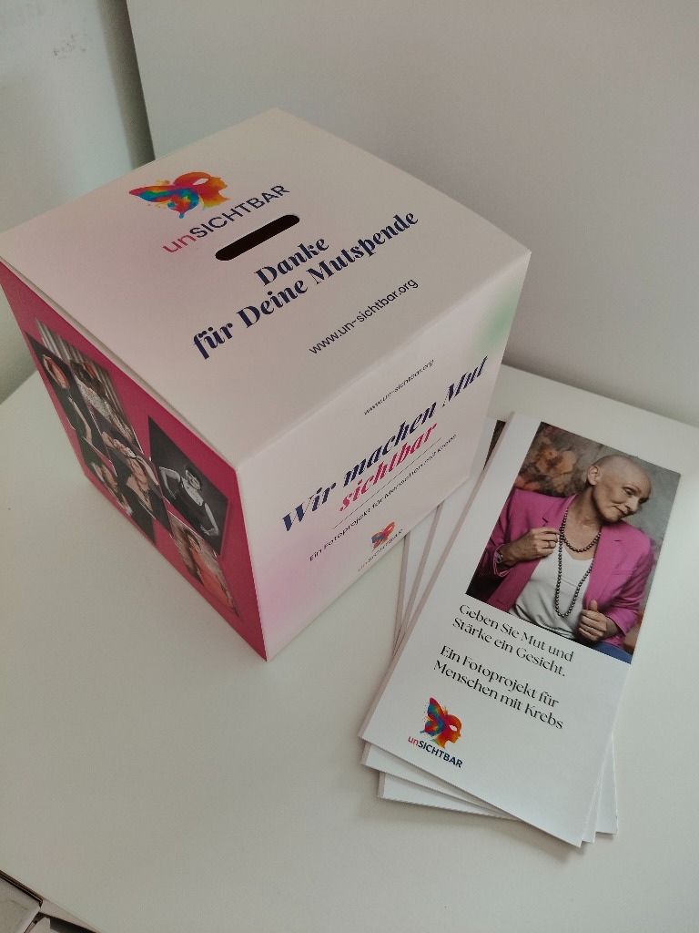 unSICHTBAR Mutmacher-Spendenbox mit Infomaterial